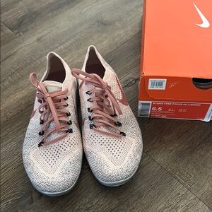 Nike Pink and Gray Athletic Shoes with Flyknit Design